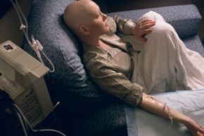 A young woman receives chemotherapy. See pictures of alternative medicines.