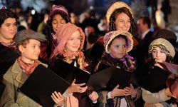 A choir sings Christmas carols outside the premiere of Disney's "A Christmas Carol" at the Odeon Leicester Square in London in 2009.”border=