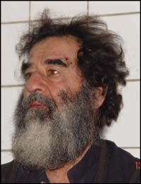A handout photo of Saddam Hussein after his capture, December 2003