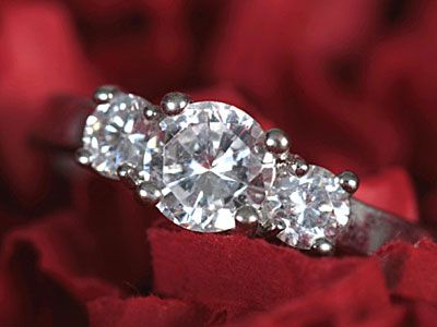 three-stone round diamond engagement ring