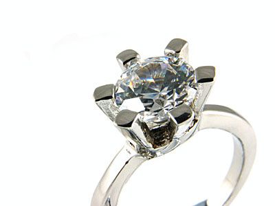 round stone with heavy platinum prongs