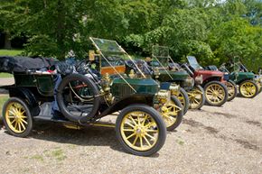 Steam-powered cars, like these vintage Stanley Steamers, are good examples of an external combustion engine being used to power an automobile.