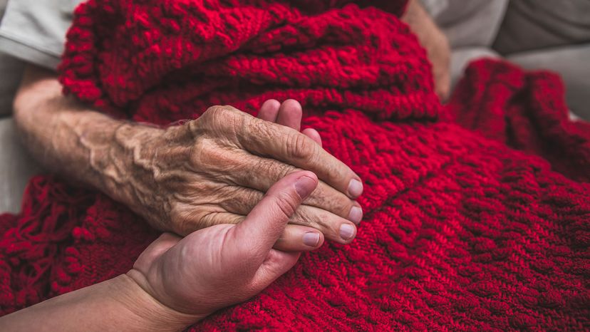 Hospice nurse visiting an elderly male patient 