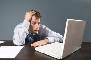 man sweating at desk