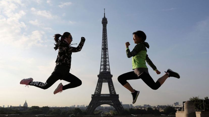 women jumping in Paris, Eiffel tower