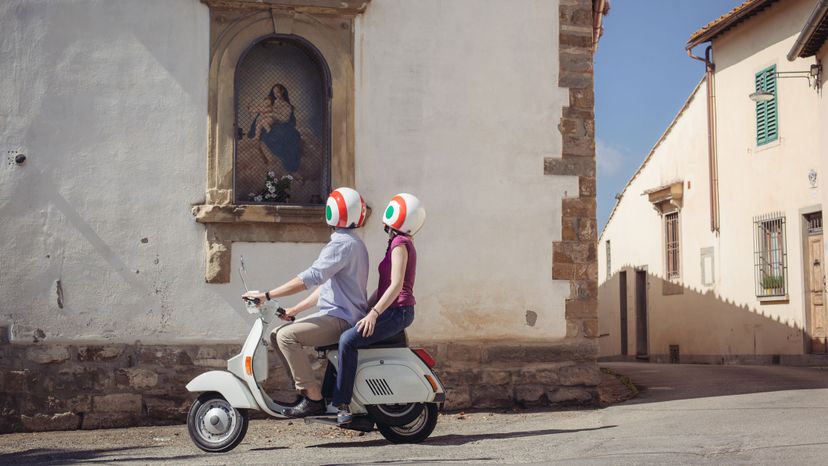 couple on moped in Italy