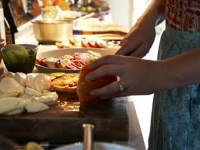 woman slicing tomatoes