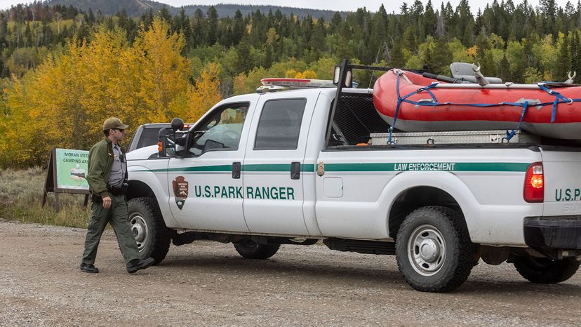 park ranger speaks with a colleague on the road to Spread Creek Campground