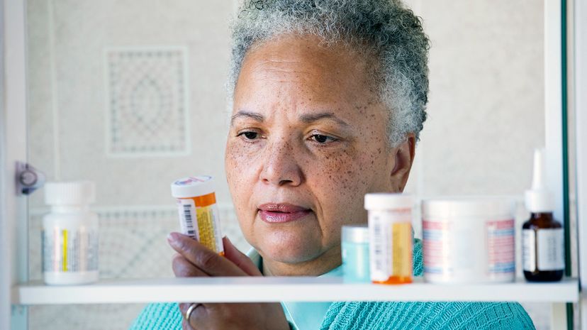 woman checking prescriptions