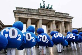 Environmental activists dressed up as CO2 molecules stage a protest in front of Berlin's landmark Brandenburg Gate in 2009 to coincide with the United Nations Climate Change Conference in Copenhagen.