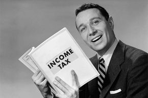 man with income tax book