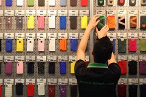 An employee arranges Apple iPhone case