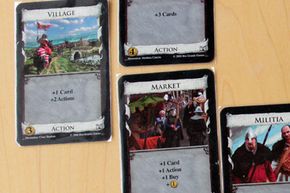 An example of an Action chain that can lead to great success. First I played a Village, giving me an extra draw and two extra actions. The first extra action (a Smithy, partially shown at top) gave me three extra draws, and the second (a Market) yet another draw and action (plus a few extra things; the Market is a powerful card).