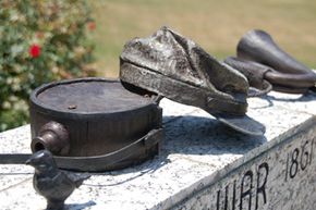 Items were bronzed for permanent outdoor display on pedestals bearing names of community members who served in each war.