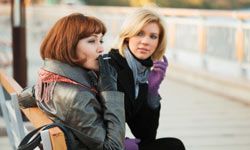 girls talking on bench