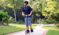 boy riding scooter