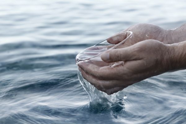 Hands cupping water