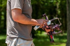 A man holding a small drone