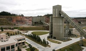 The Cementos Artigas plant near Montevideo, Uruguay, produces portland cement by grinding recycled gypsum and portland cement clinker using rice husk as fuel, per the Kyoto Protocol.