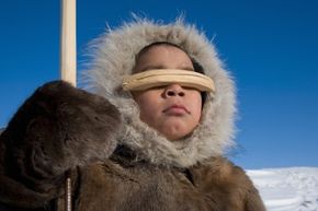 Inuits wear warm clothing like coats made of animal hides and fur to generate heat.
