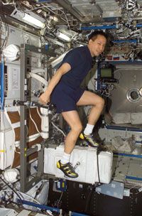 Astronaut Edward T. Lu exercises on the Cycle Ergometer with Vibration Isolation System (CEVIS) in the Destiny laboratory on the International Space Station (ISS). Why are astronauts onboard the ISS working out all the time? See more astronaut pictures.