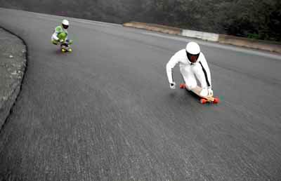 longboarding down a road in canada