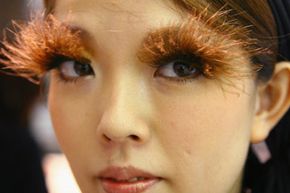 A woman models false eyelashes in Shu Uemura's eyelash bar. See our make up tips pictures.