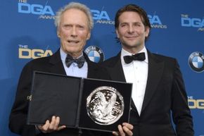 Clint Eastwood and Bradley Cooper pose for a photo at the DGA Awards. 