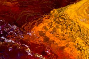 The Rio Tinto gets its reddish color from the iron present in its water; scientists have studied its ecosystem because of its similarities to the planet Mars.