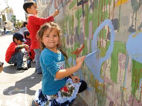 Audrey Jackson celebrates Earth Day 2008 by painting a mural at the Wilshire Center in Los Angeles.