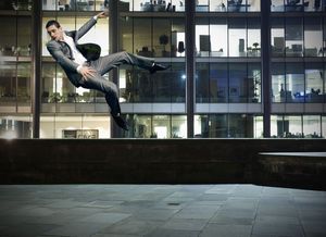 Man floating in the sky of a city landscape