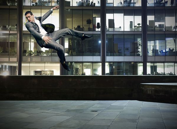 Man floating in the sky of a city landscape