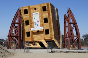 A four-story wood frame building is tested under the conditions of a number of historical earthquakes using the world's largest outdoor shake table by researchers at the University of San Diego California on Aug. 17, 2013.