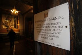 This earthquake warning sign was posted at the entrance to the basilica at the Carmel Mission in Carmel, Calif. The basilica started getting a seismic retrofit in 2012.