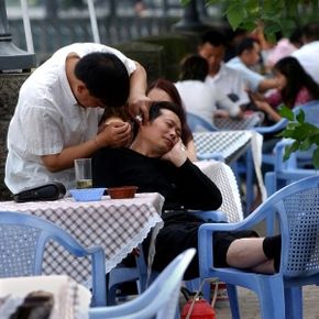 A Chinese man has his earwax picked by a chiropodist at an outdoor tea house in Chengdu, China. Contrary to what many people believe, there's no need to remove earwax unless it's impacted.