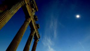 solar eclipse with ancient greek temple