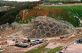 Workers assemble the steel framework of the greenhouses. The Eden Project crew broke the world record for largest free-standing scaffold.