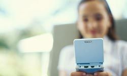 girl with handheld video game