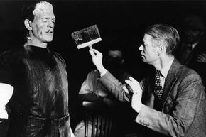 Boris Karloff (with cigarette) is dirtied by director James Whale in between scenes from the 1931 film 'Frankenstein.' See our creature effects image gallery.