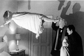 Max von Sydow (center) as Father Merrin, and Jason Miller as Father Karras perform an exorcism on Regan MacNeil (played by Linda Blair) in 'The Exorcist.'