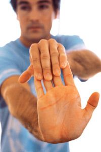 Young man stretching his hands