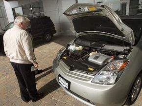 Although makers of available conversion kits claim to make cars like the Prius pictured above more efficient, there may be additional risks and challenges that come with them.