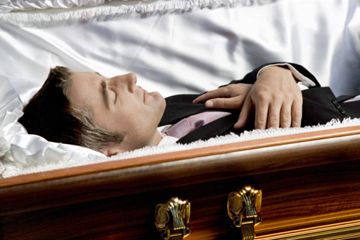 Man lying in casket
