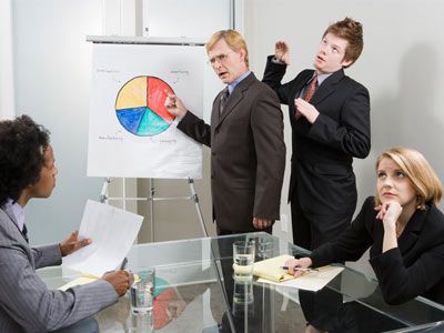 Business man mimicking other man during meeting 