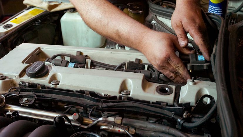 Man Working on Engine Auto Parts