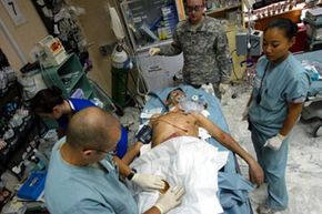 Combat surgery has come a long way since the unmedicated amputations of the Civil War. Here, U.S. Army Dr. Robert Mazur and his staff work on an Iraqi soldier with a bullet lodged in his heart at the 10th Combat Support Hospital in Baghdad, Iraq.