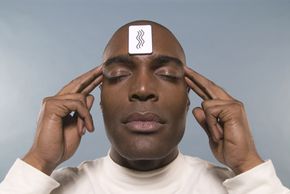 Man trying to guess card on his forehead