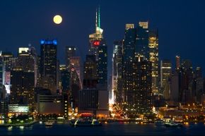 The super moon rises over the Manhattan skyline. 