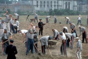 Prisoners work in the field in a scene from "The Shawshank Redemption."