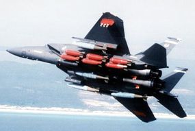 The F-15 Strike Eagle (bottom) carries a number of air-to-ground weapons in addition to the air-to-air weapons you'll find on an F-15C (top).
